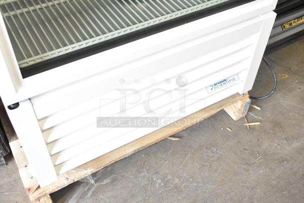 2025 True TSCI-600R-G-PH cooler merchandiser, single door, white exterior, glass display, True Scientific label, on pallet.