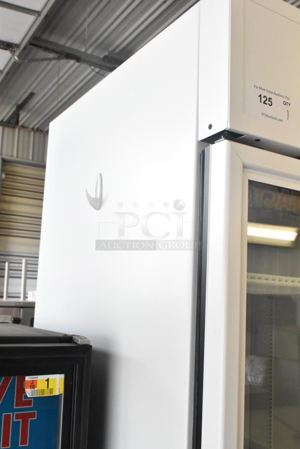 2025 True TSCI-600R-G-PH single door reach-in cooler merchandiser, 115V, excellent condition. Label reads "125 QTY."