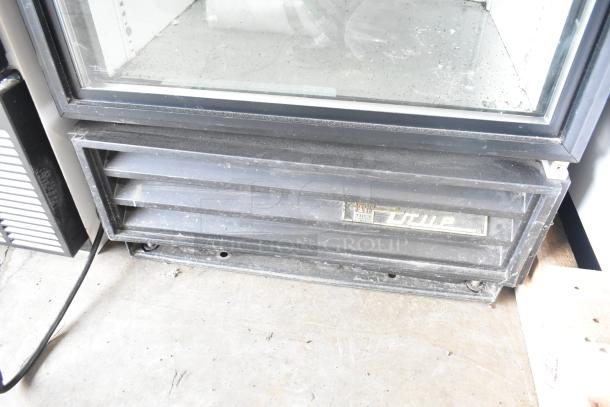 True GDM-12 single door cooler, 115 Volts, dust marks, visible "True" logo, commercial use, used condition.
