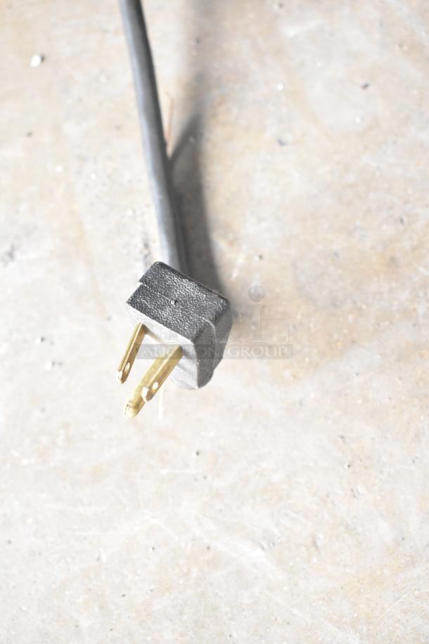 Close-up of power plug for True GDM-12 Commercial Cooler, showcasing its 115-volt, single-phase compatibility.