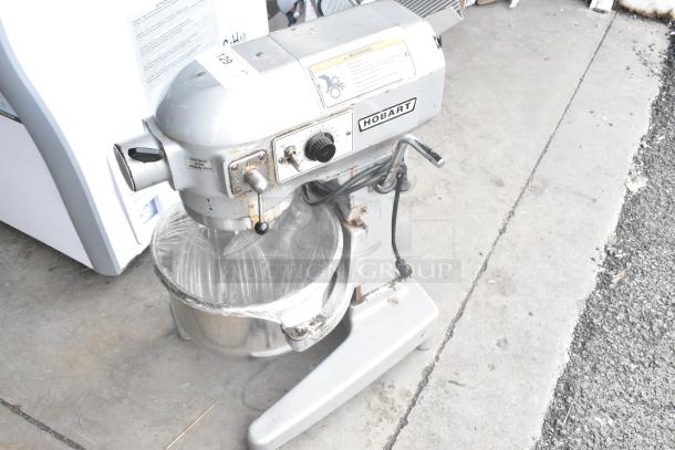 Hobart A120 12-quart dough mixer with bowl, whisk, and paddle, 115V, 1 phase. Used condition, silver finish.