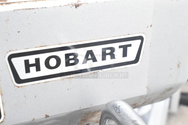 Hobart A120 Commercial 12 Quart Planetary Mixer with bowl, whisk, and paddle; 115V, 1 Phase. Slightly worn exterior.