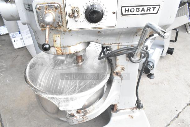Hobart A120 commercial 12-quart planetary dough mixer with mixing bowl, whisk, and paddle attachments. 115 volts, 1 phase.
