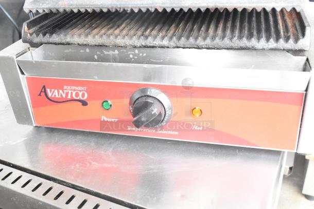 Avantco 177P7B countertop panini press, red front panel, dual indicator lights, temperature dial, 120 volts, used condition.