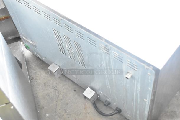 Avantco CO-16 countertop convection oven, 1.5 cu. ft., 120V, rear view, visible power cord and ventilation slots.