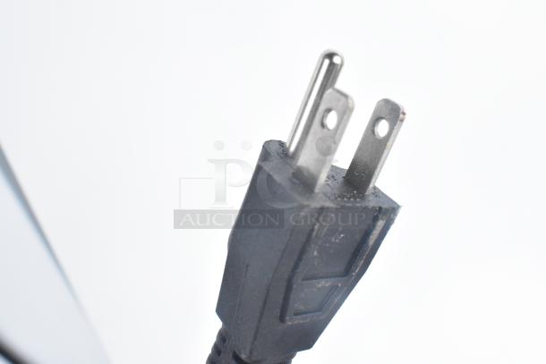 Close-up of a power plug for the Avantco 177P78 Panini Press, showing a three-prong connector.