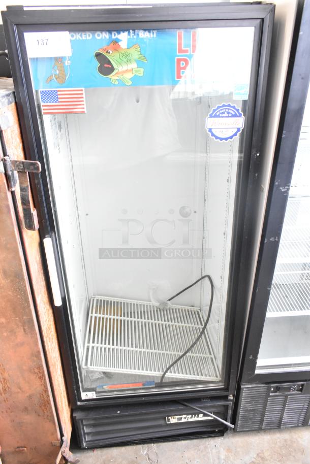True GDM-12 commercial single door reach-in cooler merchandiser, 115V, with glass door and interior shelves, in used condition.
