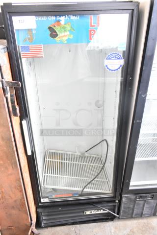 True GDM-12 commercial single door reach-in cooler merchandiser, 115V, with glass door and interior shelves, in used condition.