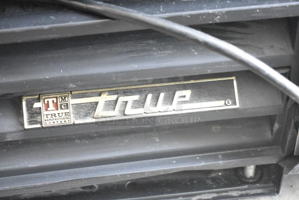 True GDM-12 Single Door Reach In Cooler Merchandiser, 115V, 1 Phase. True logo plate visible.