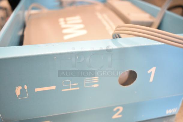 IN ORIGINAL BOX! Nintendo Wii Game Console, 115 Volts, 1 Phase, visible in blue packaging, key features on side.