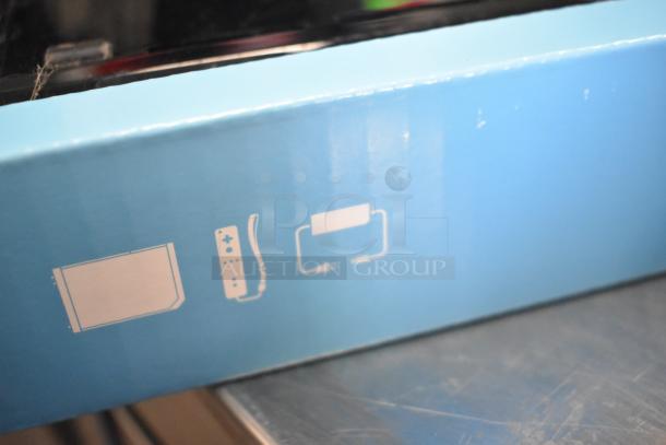 Nintendo Wii game console in original blue box, illustrated with icons of console and remote. 115 volts, 1 phase.