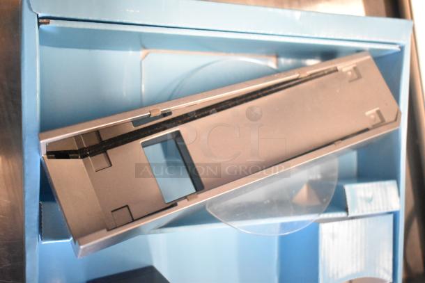 Nintendo Wii console in original packaging, 115 volts, 1 phase. Appears in excellent condition with visible slot opening.