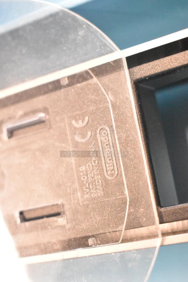 Nintendo Wii console with label markings, featuring brand name and model details. In original box, 115 volts, 1 phase.