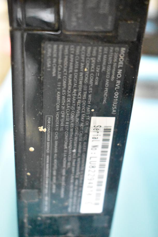 Nintendo Wii console with model no. RVL-001(USA), serial no. LU82294031, 115V, in original box, shown with label details.