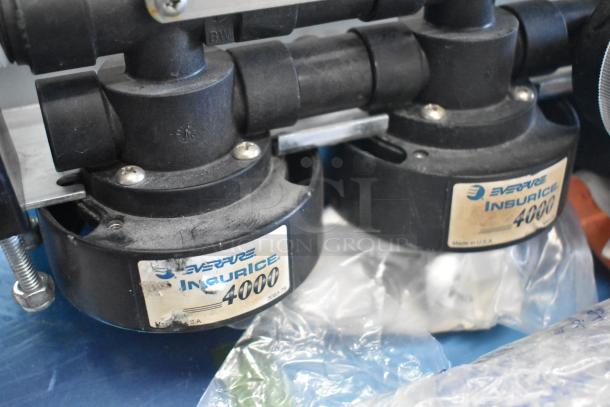 Three items: Everpure 4000 water filter head, Marinco CL40FC-B protective cap, Hoshizaki ice machine door. Used condition.