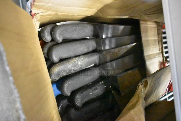 Box of 100 sharpened stainless steel knives with black handles. Includes chef knife. Used, visible wear on handles.