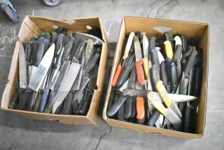 Two boxes of 230 sharpened stainless steel knives, varying types including chef knives, black and colored handles.