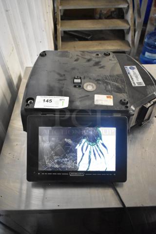 2017 Hobart HTi-7LH26 commercial scale with screen damage. No power cord included. 120/208-240V, 1 phase. Working condition.