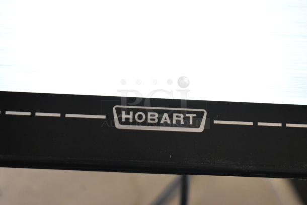 2024 Hobart HTi-7LH4W commercial scale in working condition. No power cord. Logo and model visible on black panel.