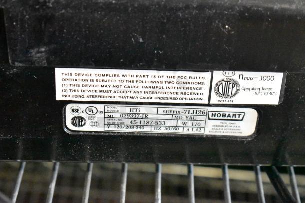 2018 Hobart HTi-7LH26 commercial scale label showing model, voltage, and certifications; tested and working condition.