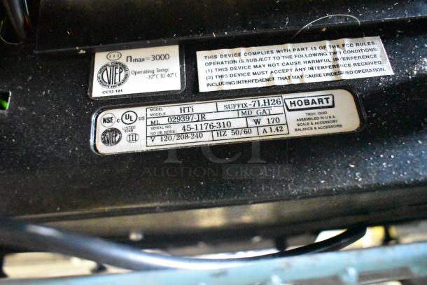 2017 Hobart HTi-7LH26 commercial countertop scale label detailing model, voltage, and certification information.