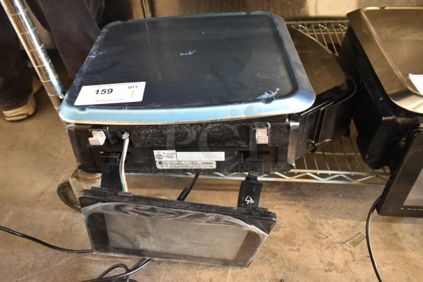 2024 Hobart HTi-7LH4W commercial scale, black, tested, non-functional, 120/208-240V, 1 phase, label visible.