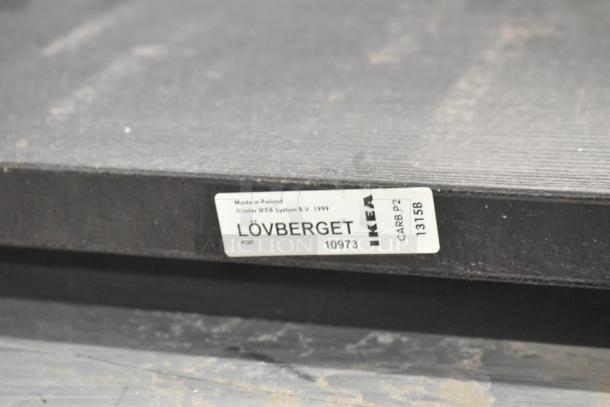 IKEA LÖVBERGET wall mount shelf, black, used condition, model 10973, made in Poland, label visible indicating CARB P2.