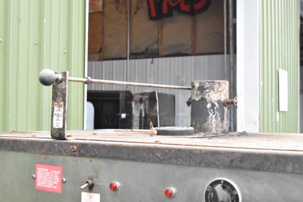 Pro Smoker 'N' Roaster 150P commercial smoker, used condition, visible vent lever, caution label, and control dial.