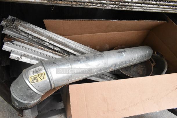 Pro Smoker 'N' Roaster 150P parts, including metal components and duct piece, in cardboard box. Good condition.