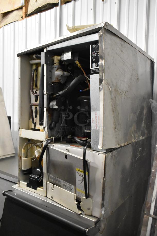 Hoshizaki KM-501MWH commercial ice machine head on ice bin; 115-120 volts, 1 phase; visible wear.