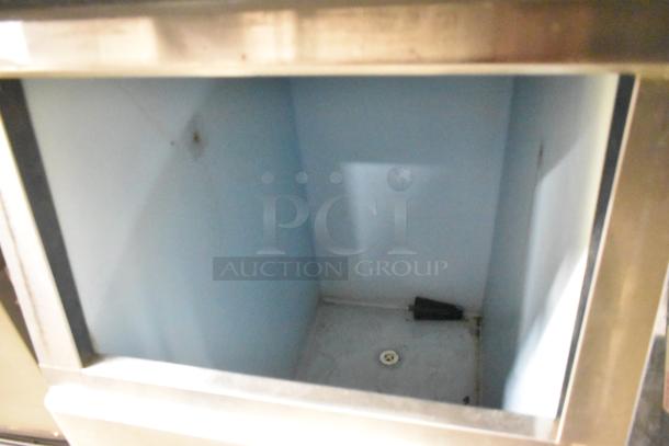 Hoshizaki KM-501MWH ice machine head with commercial ice bin, shown in stainless steel. Operates on 115-120 volts, 1 phase.