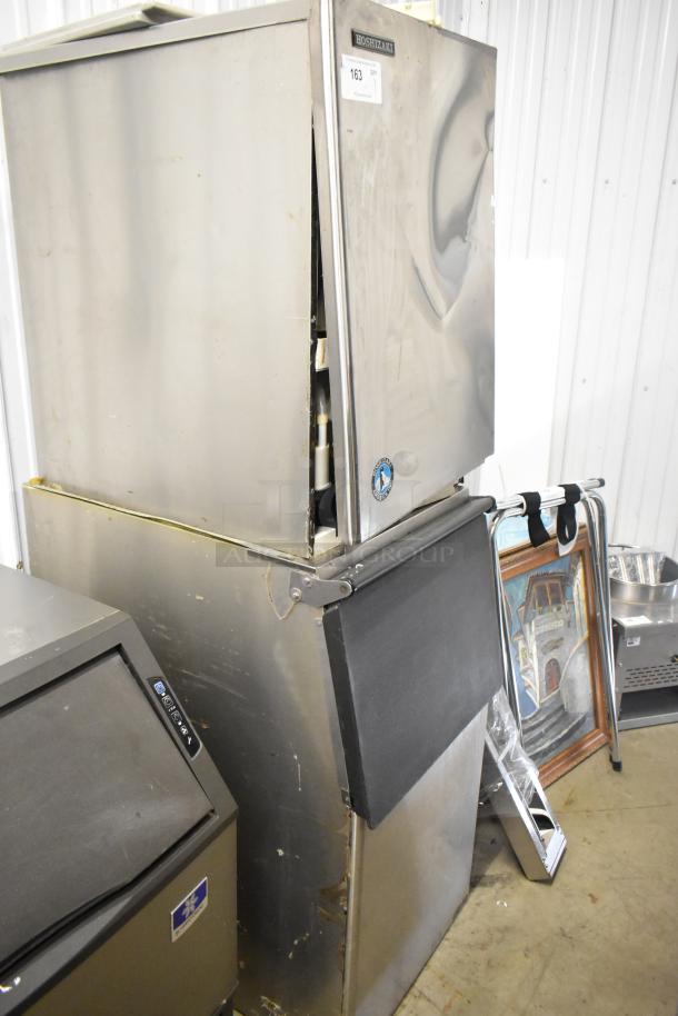 Hoshizaki KM-501MWH commercial ice machine head on ice bin. 115-120V, 1 phase. Stainless steel, used condition.