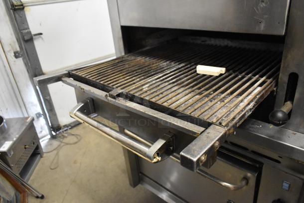 Montague Vectaire commercial gas upright vertical broiler with metal grill and handle in used condition.
