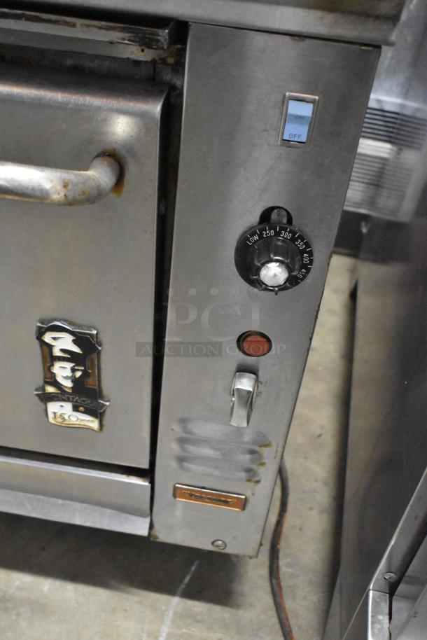 Montague Vectaire gas upright vertical broiler, stainless steel, temperature dial from low to 450°F, visible Montague brand plaque.