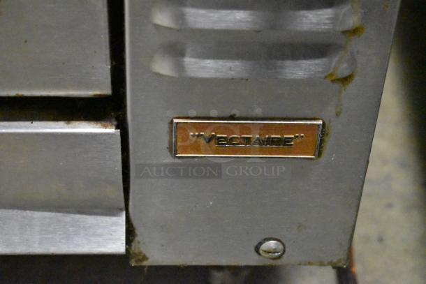 Montague Vectaire commercial gas upright broiler, stainless steel, features visible branding, moderate wear.