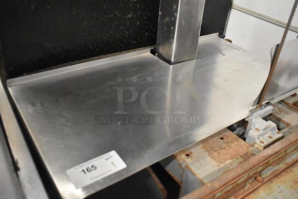 Hobart commercial floor style meat saw with stainless steel table, visible wear, and auction tag number 165.