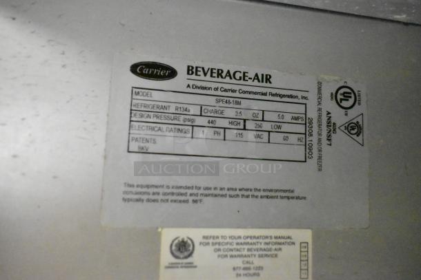 Beverage Air SPE48-18M label with specs: 115V, 1 Phase, refrigerant R134a, 9.5 oz charge. Commercial prep table model info.