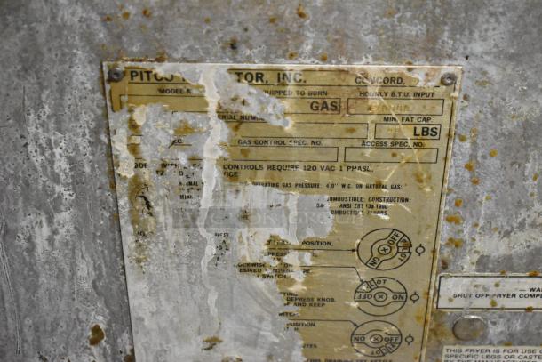 Pitco Frialator commercial gas deep fat fryer with visible worn label detailing specifications and operating instructions.