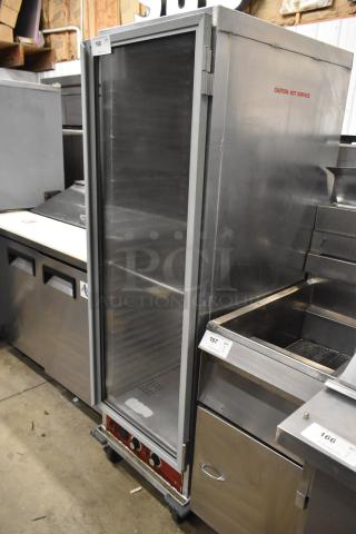 Avantco 177HPI1836 commercial heated holding cabinet, stainless steel, on casters, 120V, 1 Phase, label reads "Caution - Hot Surface."