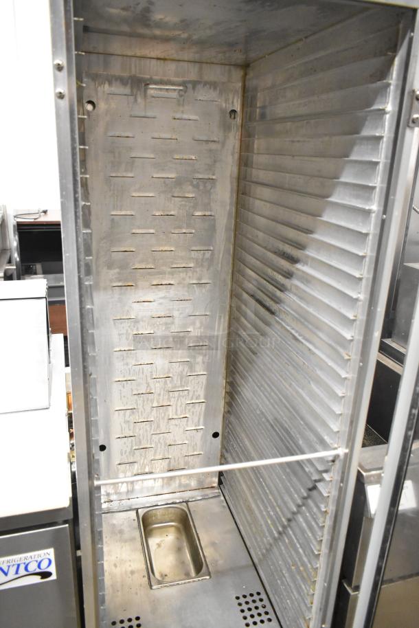 Avantco 177HPI1836 commercial heated holding cabinet on casters, 120V, 1 phase, interior view showing shelves and vents.