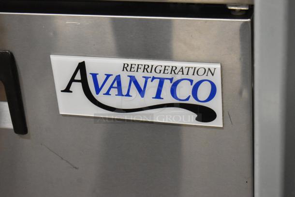 Avantco 178APT48HC Refrigeration label on commercial sandwich salad prep table, stainless steel finish, minor scratches visible.