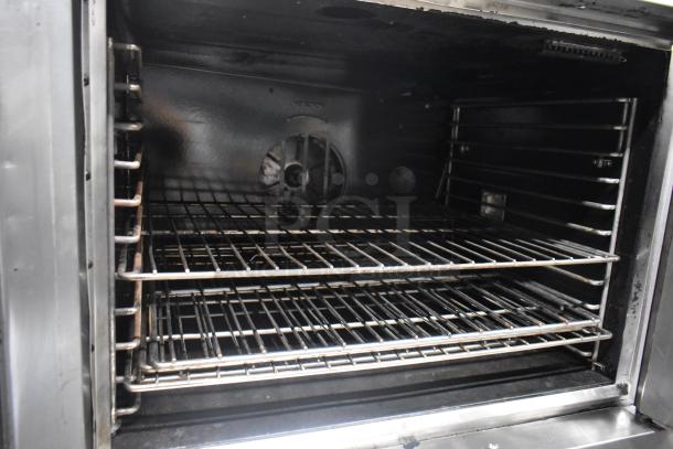 Cooking Performance Group 351FGC100N commercial convection oven with view-through doors, natural gas, 54,000 BTU, on casters.