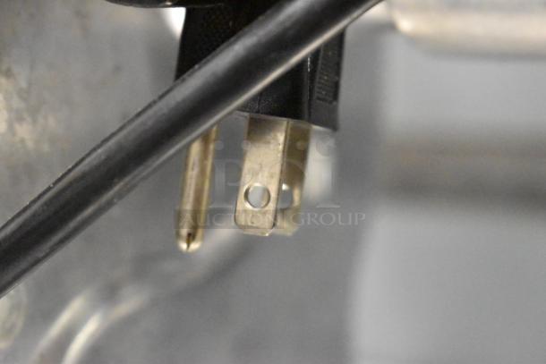 Close-up of plug prongs from a Backyard Pro 554BSG12 Electric Meat Grinder, 120 volts, 1 phase.
