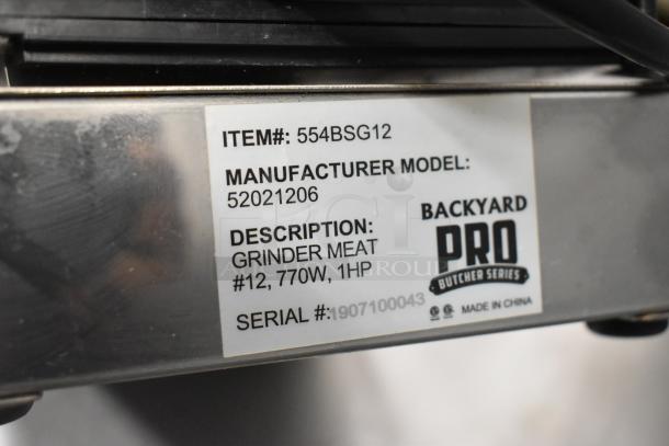 Backyard Pro 554BSG12 Electric Meat Grinder tag. Includes model, 770W, 1HP, serial number, and "Made in China."