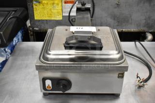 Anvil TSA 7009 countertop panini press, stainless steel, with control knob and label. Used, with visible wire damage.