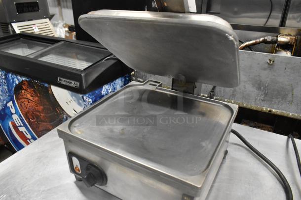 Anvil TSA 7009 Panini Press, stainless steel, countertop model, good condition, visible control knob and power cord.