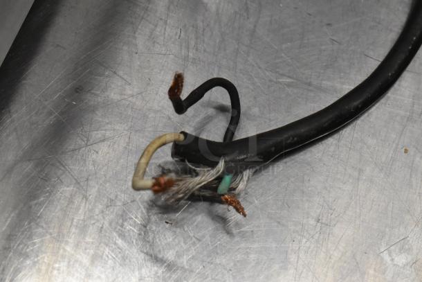 Damaged power cord of Anvil TSA 7009 Panini Press, with exposed wires, likely indicating need for repair.