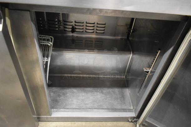 Avantco 178SSUC48RHC Commercial 2 Door Undercounter Cooler, stainless steel interior, 115V, 1 Phase, open door view.