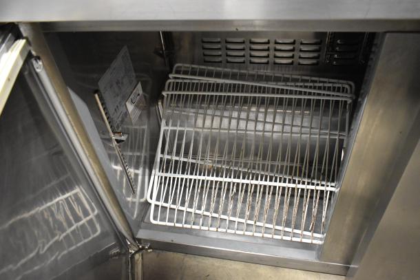 Avantco 178SSUC48RHC commercial 2-door undercounter cooler, interior view, shows racks and label, 115V, 1 phase.