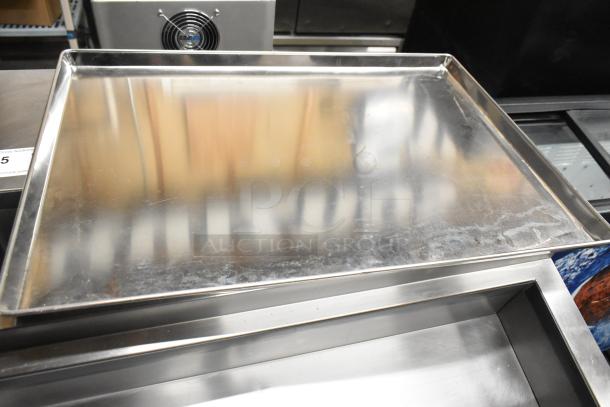 20 metal full-size baking pans, slightly used. Smooth surface, ideal for commercial kitchens. Auction lot of 20 pans.
